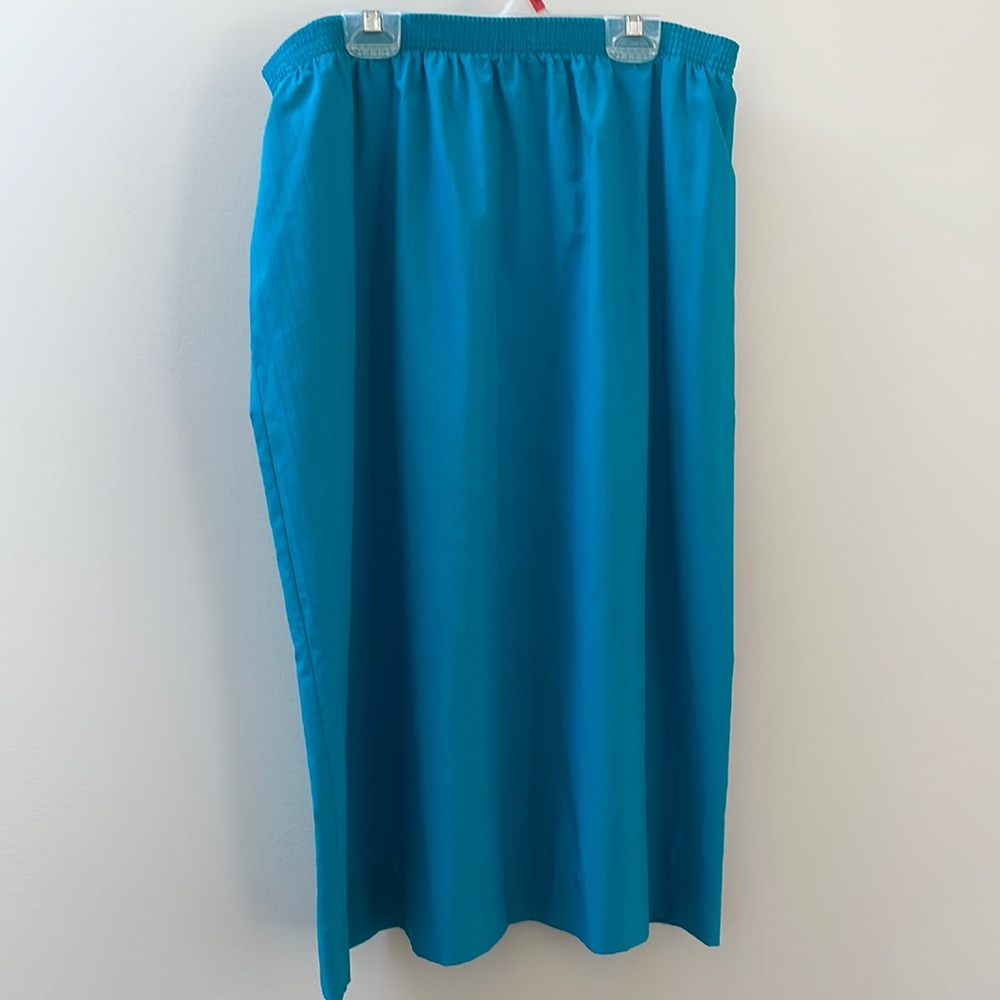 This teal skirt is beautiful and feels like silk, but with easy to care fabric.